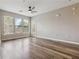 Well-lit living room with wood floors, neutral walls, fan, and access to patio at 898 Oak Sw St # 3228, Atlanta, GA 30310