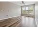 Bright living room featuring wood floors, neutral walls, large windows and ceiling fan at 898 Oak Sw St # 3228, Atlanta, GA 30310