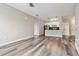 Bright open-concept living area with wood-look flooring flows into a modern kitchen at 898 Oak Sw St # 3228, Atlanta, GA 30310