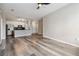 Bright open-concept living area with wood-look flooring flows into a modern kitchen at 898 Oak Sw St # 3228, Atlanta, GA 30310