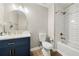 Stylish bathroom with a blue vanity, gold fixtures, subway tiles, and a modern sink at 2706 Del Ridge Dr, Douglasville, GA 30135