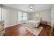 Cozy bedroom featuring a neutral color palette, ceiling fan, and hardwood floors at 2706 Del Ridge Dr, Douglasville, GA 30135