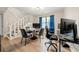 Bonus room with a game and office area, a stairway, a modern light fixture and a window with natural light at 2706 Del Ridge Dr, Douglasville, GA 30135