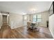 Dining area with an elegant chandelier, hardwood floors, and bright natural light at 2706 Del Ridge Dr, Douglasville, GA 30135