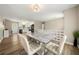 Open dining area with modern chairs, hardwood floors, and adjacent to the kitchen at 2706 Del Ridge Dr, Douglasville, GA 30135