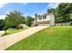 Charming two-story home features a long driveway, two-car garage, and a welcoming front yard at 2706 Del Ridge Dr, Douglasville, GA 30135