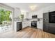 Bright, renovated kitchen with stainless steel appliances and an adjacent back deck at 2706 Del Ridge Dr, Douglasville, GA 30135
