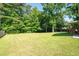 Expansive lawn with privacy and mature trees at 2880 Brett Nw Cir, Acworth, GA 30101
