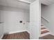 Unfinished basement area with wooden stairs, ready for your personal touch at 2880 Brett Nw Cir, Acworth, GA 30101