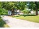 Home showcasing a lengthy driveway leading to a two-story home with an attached garage at 2880 Brett Nw Cir, Acworth, GA 30101