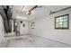 Empty garage featuring a large window, with space for vehicles and storage at 2880 Brett Nw Cir, Acworth, GA 30101