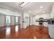 Bright kitchen boasts stainless steel appliances, granite counters, and hardwood flooring throughout at 2880 Brett Nw Cir, Acworth, GA 30101