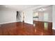 Spacious living room with hardwood floors open to the kitchen and stairway at 2880 Brett Nw Cir, Acworth, GA 30101