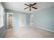 Spacious bedroom with blue walls, carpet, closet and ensuite bathroom view at 2880 Brett Nw Cir, Acworth, GA 30101