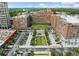 Aerial view of Ponce City Market with ample parking space surrounded by lush green trees and colorful murals at 650 Glen Iris Ne Dr # 26, Atlanta, GA 30308