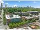 Stunning aerial view of a residential building with the city skyline in the background surrounded by mature trees at 650 Glen Iris Ne Dr # 26, Atlanta, GA 30308