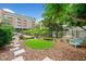 Outdoor dog park area with lush green grass, seating and manicured landscaping near a building at 650 Glen Iris Ne Dr # 26, Atlanta, GA 30308