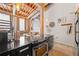Open concept kitchen area featuring black countertops and stainless steel appliances with industrial architectural details at 650 Glen Iris Ne Dr # 26, Atlanta, GA 30308