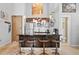 Modern kitchen with an island and bar stool seating with stainless steel appliances and bright lighting at 650 Glen Iris Ne Dr # 26, Atlanta, GA 30308