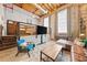 Open living space with a rustic bedroom area and exposed wooden ceiling at 650 Glen Iris Ne Dr # 26, Atlanta, GA 30308