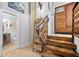 Wooden staircase with steel railings adjacent to a bathroom, adding unique character to the property at 650 Glen Iris Ne Dr # 26, Atlanta, GA 30308