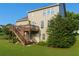 Beautiful backyard with a large deck, lush green lawn, and mature trees at 730 Midway Ave, Canton, GA 30114