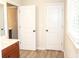 Bathroom featuring double doors and plank flooring, providing ample space to relax and take care of your health at 730 Midway Ave, Canton, GA 30114