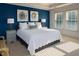 Bright bedroom featuring a plush king-size bed, modern decor, and abundant natural light from two large windows at 730 Midway Ave, Canton, GA 30114
