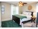 Relaxing bedroom featuring a ceiling fan and a comfortable bed, providing a warm and inviting place to rest at 730 Midway Ave, Canton, GA 30114