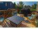 Cozy outdoor deck with comfortable seating, a fire table, and a grill at 730 Midway Ave, Canton, GA 30114