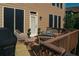 Outdoor deck furnished with wicker furniture, a grill, and potted plants at 730 Midway Ave, Canton, GA 30114