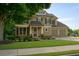Charming two-story home with a well-manicured lawn and a two-car garage at 730 Midway Ave, Canton, GA 30114