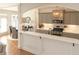 Bright kitchen featuring gray cabinets and an island, providing ample space to cook and entertain guests at 730 Midway Ave, Canton, GA 30114