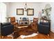 Living room with leather chairs and a cowhide rug at 730 Midway Ave, Canton, GA 30114