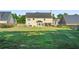 Large, level backyard featuring lush green grass, offering plenty of room for recreation and relaxation at 85 Shiver Blvd, Covington, GA 30016