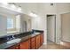 Bright bathroom featuring double vanity with granite countertop and tile flooring at 85 Shiver Blvd, Covington, GA 30016