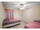 Cozy bedroom with twin beds and neutral decor at 85 Shiver Blvd, Covington, GA 30016