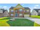 Charming two-story brick home with a lush green lawn and a welcoming blue front door at 85 Shiver Blvd, Covington, GA 30016