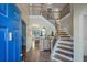 Elegant foyer with hardwood floors, a staircase with iron railings, and a view into the living area at 85 Shiver Blvd, Covington, GA 30016