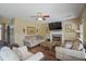 Inviting living room with hardwood floors, a fireplace, and comfortable seating, perfect for relaxation at 85 Shiver Blvd, Covington, GA 30016