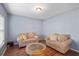 Cozy living room with comfortable sofas, decorative pillows, and hardwood floors at 85 Shiver Blvd, Covington, GA 30016