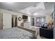 Large main bedroom with a tray ceiling, television, and a comfortable seating area at 85 Shiver Blvd, Covington, GA 30016