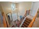 Grand staircase with wooden railings and a view of the foyer at 85 Shiver Blvd, Covington, GA 30016