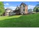 Beautifully landscaped backyard featuring a spacious lawn and well-maintained exterior of the two-story home at 2539 Sagebrush Trl, Buford, GA 30519