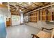 Unfinished basement space with exposed ceiling, concrete floor and storage at 2539 Sagebrush Trl, Buford, GA 30519