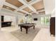 Finished basement with pool table, tile flooring, and wet bar at 2539 Sagebrush Trl, Buford, GA 30519