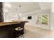 Basement wet bar features wood countertop, dark cabinetry, and recessed lighting, with view of window and television at 2539 Sagebrush Trl, Buford, GA 30519