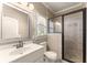 Bathroom with walk in shower, modern fixtures, and light wood cabinets at 2539 Sagebrush Trl, Buford, GA 30519