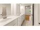 Bright bathroom featuring double vanity with white cabinets and tile floors at 2539 Sagebrush Trl, Buford, GA 30519