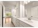 Bright bathroom featuring double vanity with white cabinets and tile floors at 2539 Sagebrush Trl, Buford, GA 30519